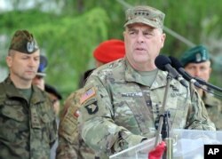 FILE - U.S. Army Chief of Staff General Mark Milley speaks during the opening ceremony of the Anaconda-16 military exercise, in Warsaw, Poland, June 6, 2016.