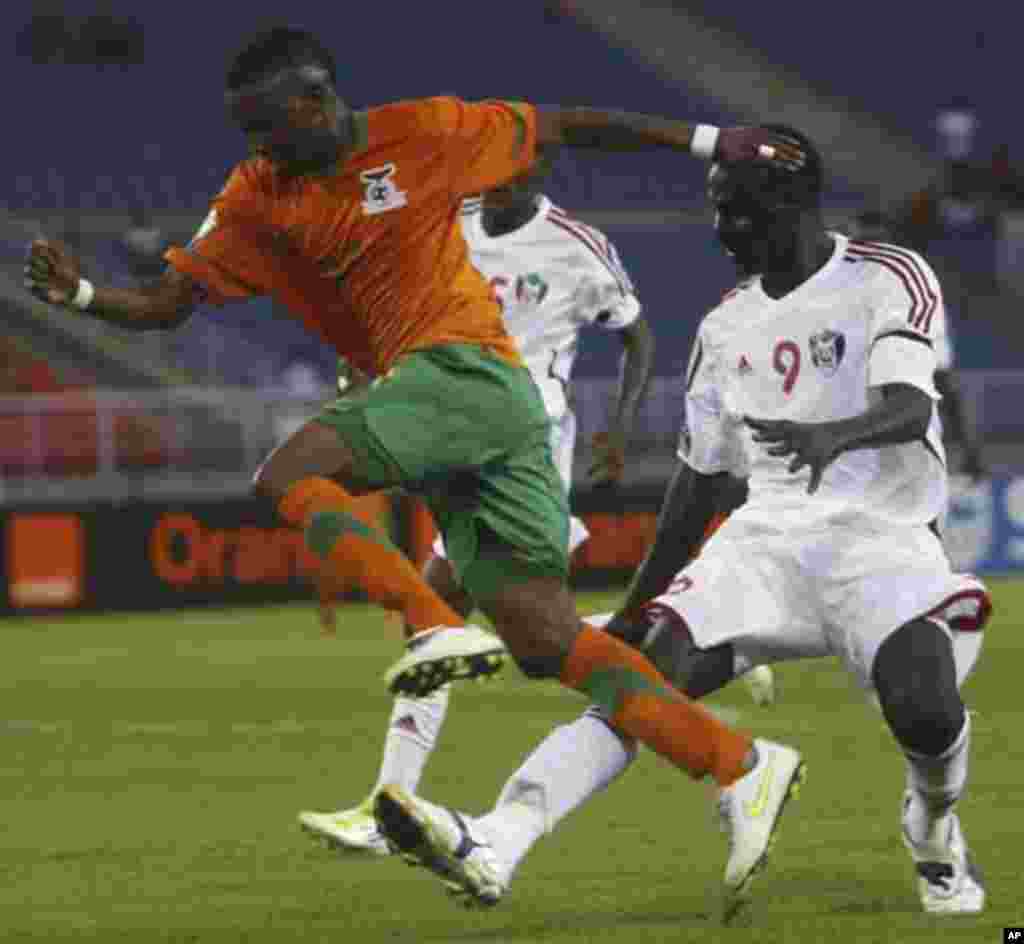 Saif Eldin Ali Idris Farah of Sudan challenges Rainford Kalaba of Zambia (L) during their African Nations Cup quarter-final soccer match at Estadio de Bata "Bata Stadium", in Bata February 4, 2012.