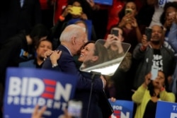 Democratic U.S. presidential candidate and former Vice President Joe Biden is greeted by U.S. Senator Kamala Harris during a campaign stop in Detroit, Michigan, U.S., March 9, 2020.