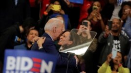 Democratic U.S. presidential candidate and former Vice President Joe Biden is greeted by U.S. Senator Kamala Harris during a campaign stop in Detroit, Michigan, U.S., March 9, 2020.