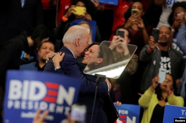 Democratic U.S. presidential candidate and former Vice President Joe Biden is greeted by U.S. Senator Kamala Harris during a campaign stop in Detroit, Michigan, U.S., March 9, 2020.