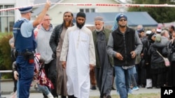 Members of Muslim religious groups leave after a special blessing ceremony near the site of Friday's shooting outside the Linwood mosque in Christchurch, New Zealand, March 18, 2019.