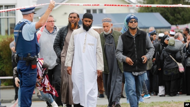 Members of Muslim religious groups leave after a special blessing ceremony near the site of Friday's shooting outside the Linwood mosque in Christchurch, New Zealand, March 18, 2019.