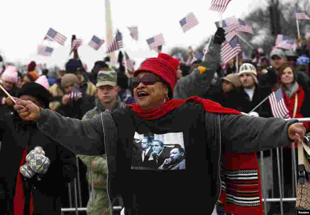 A woman smiles on the National Mall during the ceremonial swearing-in ceremonies on the West front of the U.S. Capitol in Washington January 21, 2013