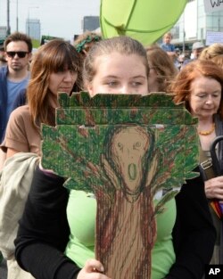 Protesters march demanding a stop to massive logging in the Bialowieza forest, one of Europe's last virgin woodlands, in Warsaw, Poland, June 24, 2017.