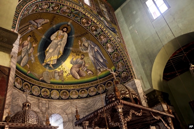A view of the mosaic of transfiguration, which                covers the surface of 46 meters square inside the basilica                of the monastery of Saint Catherine, is shown, Dec 16,                2017, in South Sinai, Egypt.