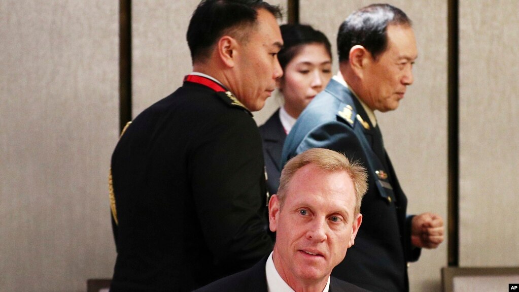 Acting U.S. Secretary of Defense Patrick Shanahan, center, and Chinese Minister of National Defense Gen. Wei Fenghe, right, attend a ministerial luncheon on the sidelines of the 18th International Institute for Strategic Studies (IISS) Shangri-la Dialogue