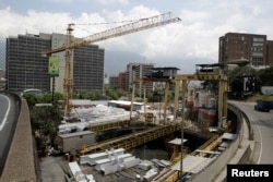 FILE - A view of a construction site by Odebrecht of a metro station is seen in Caracas, Venezuela, March 29, 2017.