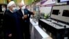Хасан Рухани рассматривает новые ядерные достижения Ирана во время Национального дня ядерной энергии 