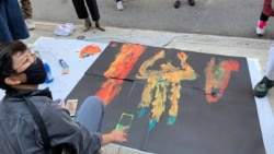 Thai pro-democracy protesters produce art piece as part of protest in front of the Royal Thai Consulate General New York on September 19, 2020