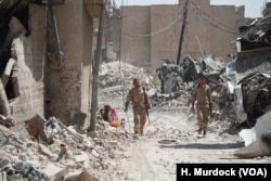 Relatives of IS are some of the last to leave the ruins of Old Mosul. It is unknown if they, like other civilians were forced to stay with IS or if they stayed to support fighters on July 13, 2017 in Mosul.