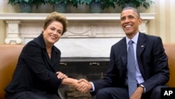 President Barack Obama and Brazilian President Dilma Rousseff meet in the Oval Office of the White House in Washington, June 30, 2015. 
