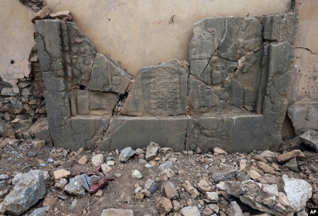 Carved stone slabs which were destroyed by Islamic State militants are seen at the ancient site of Nimrud, some 19 miles (30 kilometers) southeast of Mosul, Iraq, Nov. 16, 2016.