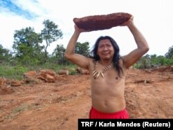 Indigenous Kamuu Dan Wapichana poses for a photo in indigenous land Santuario dos Pajes in Brasilia, Dec. 3, 2017.