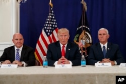 President Donald Trump, flanked by National Security Advisor H.R. McMaster, left, and Vice President Mike Pence, speaks to reporters after a security briefing at Trump National Golf Club in Bedminster, N.J., Aug. 10, 2017.
