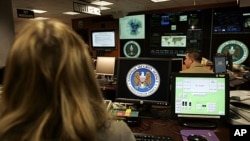 FILE - Employees of the National Security Agency work in the Threat Operations Center in Fort Meade, Maryland. (2006 file photo)