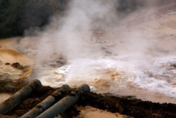 FILE PHOTO: Polluted water flows out of pipes from a rare earth factory near Baotou, a city in China's Inner Mongolia Autonomous Region in this picture from 2010. (Reuters)ure.