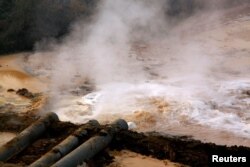 FILE PHOTO: Polluted water flows out of pipes from a rare earth factory near Baotou, a city in China's Inner Mongolia Autonomous Region in this picture from 2010. (Reuters)ure.