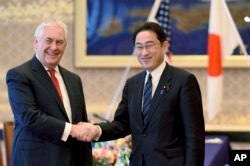 U.S. Secretary of State Rex Tillerson is welcomed by his Japanese counterpart Fumio Kishida at the Iikura Guesthouse in Tokyo, March 16, 2017.