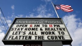A neighborhood market marquee reads 