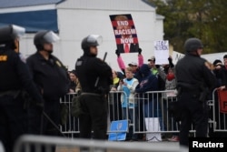Counterprotesters line the street across from a White Lives Matter rally in Shelbyville, Tenn., Oct. 28, 2017.