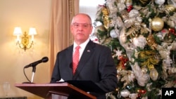 FILE - Louisiana Gov. John Bel Edwards speaks to reporters at his end-of-the-year press conference Dec. 16, 2021, in Baton Rouge, La.