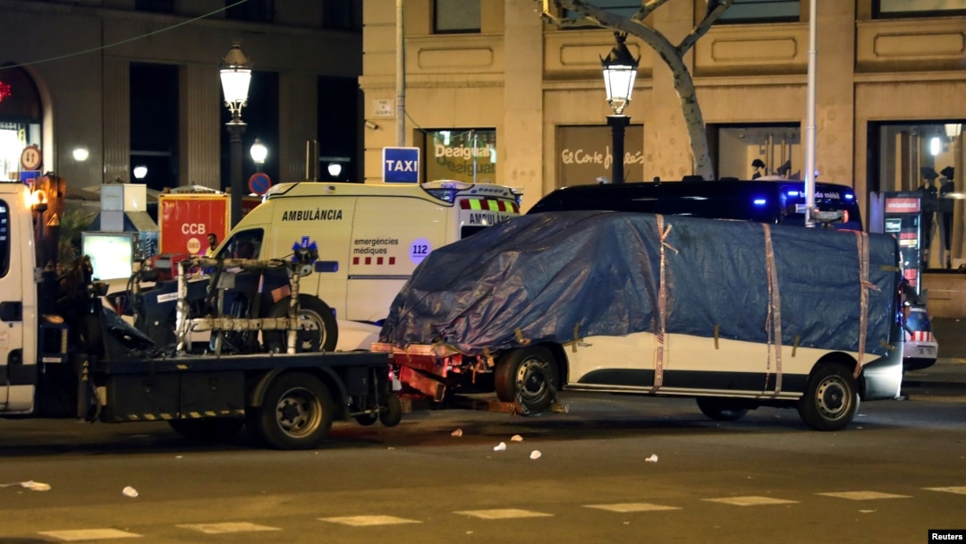 The suspected van is towed away from the area where it crashed into pedestrians at Las Ramblas in Barcelona, Spain, Aug. 18, 2017.