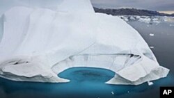 An iceberg melting off the coast of Ammasalik Greenland. Each year more ice disappears from the Arctic Ocean. (file photo)