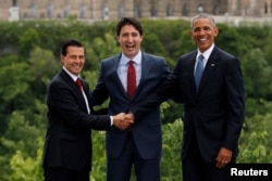 From left, Mexico's President Enrique Pena Nieto, Canada's Prime Minister Justin Trudeau and U.S. President Barack Obama pose for family photo at the North American Leaders' Summit in Ottawa, Ontario, Canada, June 29, 2016.
