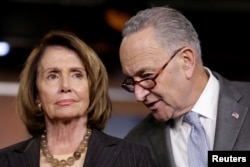 FILE - House Minority Leader Nancy Pelosi (D-California), left, and Senate Minority Leader Chuck Schumer (D-New York) speak during a briefing on Capitol Hill in Washington, Nov. 2, 2017. Both Pelosi and Schumer delined meeting with President Donald Trump over a possible government shutdown after Trump indicated he saw no deal in the offing.