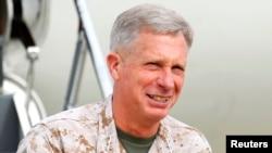 FILE - Marine Corps General Thomas Waldhauser, pictured in March 2012, says the economic crisis confronting today's African youth is "the biggest challenge" on the continent.