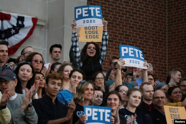FILE - Attendees cheer as 2020 Democratic presidential candidate Pete Buttigieg speaks at a campaign event in Des Moines, Iowa, April 16, 2019.