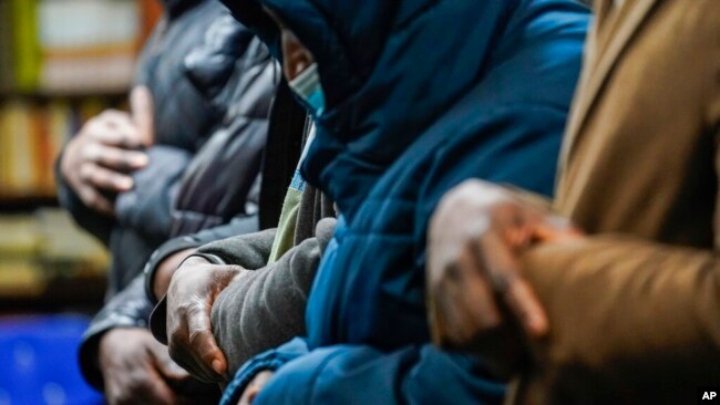 Members of the Masjid Ar Rahman pray, in the Bronx borough of New York, Jan. 12, 2022. The mosque is a place of worship for some of the residents of the building, site of New York City's deadliest fire in three decades.