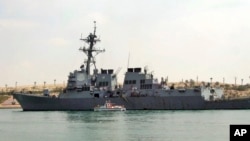 FILE - The U.S. destroyer USS Mason sails in the Suez canal in Ismailia, Egypt, March 12, 2011. Two missiles fired from rebel-held territory in Yemen landed near the destroyer in the Red Sea.