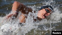 Rob Muffels of Germany competes in the men's 5km open water race at the Aquatics World Championships in Kazan, Russia, July 25, 2015. A recent British study reports that participation in specific sports - including swimming - reduce the risk of dying from heart disease or stroke. 