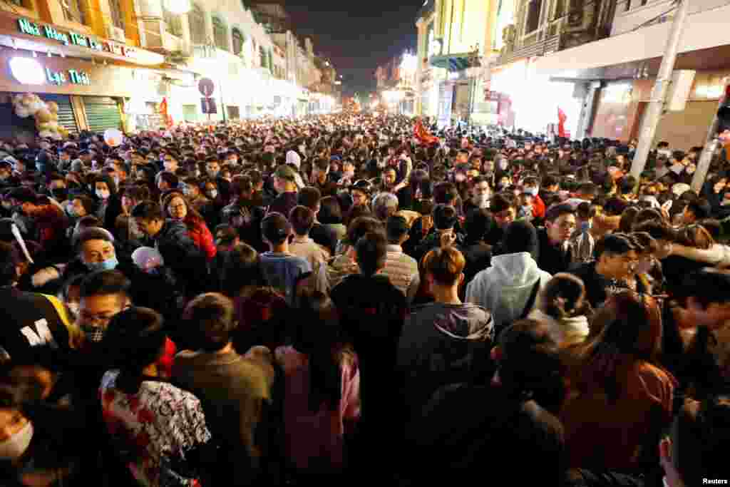 People gather on a street during New Year&#39;s Eve celebrations in Hanoi, Vietnam Jan. 1, 2021.