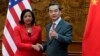 U.S. National Security Advisor Susan Rice, left, shakes hand with Chinese Foreign Minister Wang Yi at the Olive Hall before a meeting at the Foreign Ministry office in Beijing, China Tuesday, Sept. 9, 2014. China and the U.S. need to avoid incidents that