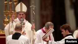 Pope Francis is seen officiating Christmas eve mass at Saint Peter's Basilica at the Vatican Dec. 24, 2013.