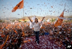 Confetti rains on presidential candidate Keiko Fujimori and her supporters during a campaign rally in the Ventanilla neighborhood, in Lima, Peru, May 31, 2016.