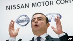 FILE - Nissan Motor Co. CEO Carlos Ghosn speaks during a press conference in Tokyo, Oct. 20, 2016.