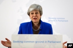 FILE - Britain's Prime Minister Theresa May delivers a speech in London, May 21, 2019.