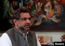 FILE - Pakistan's Petroleum and Natural Resources Shahid Khaqan Abbasi speaks during an interview at his office in Islamabad, Pakistan, Nov. 8, 2013.