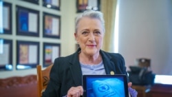 Berit Reiss-Andersen, chair of the Nobel Committee, shows a displayed image with the logo of the World Food Program, humanitarian organization which has been announced as the Nobel Peace Prize laureate, in Oslo, Norway October 9, 2020.