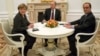 Путин, Меркель и Олланд обсудили по телефону ситуацию в Украине