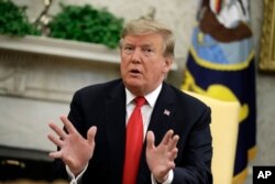 President Donald Trump speaks as he meets with NATO Secretary General Jens Stoltenberg in the Oval Office of the White House, April 2, 2019, in Washington.