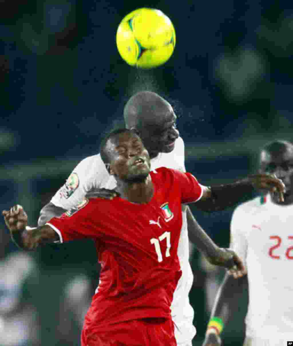 Ekanga of Equatorial Guinea challenges N'Daw of Senegal during their African Nations Cup Group A soccer match at Estadio de Bata