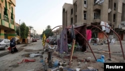 Le site d'un attentat à la voiture piégée dimanche à Bagdad en Irak (Reuters)