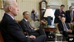 President Barack Obama and Vice President Joe Biden meet with the co-chairmen of the president's deficit reduction commission, including Alan Simpson, right, in the Oval Office of the White House in Washington, April 14, 2011