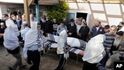 Israelis carry the body of Raziel Shevah during his funeral in Havat Gilad, an unauthorized Israeli settlement outpost near the Palestinian city of Nablus, Jan. 10, 2018. Shevah, an Israeli settler, was killed in a drive-by shooting that occurred Tuesday night.