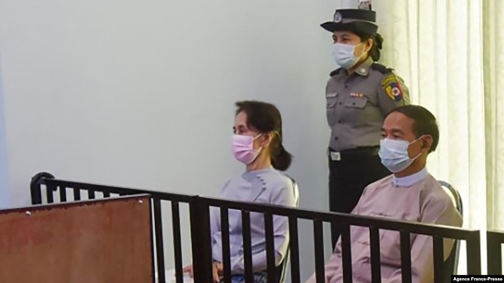 FILE - This handout photo taken May 24, 2021, and released by Myanmar's Ministry of Information May 26, shows detained civilian leader Aung San Suu Kyi (L) and detained president Win Myint (R) during their first court appearance in Naypyidaw. 